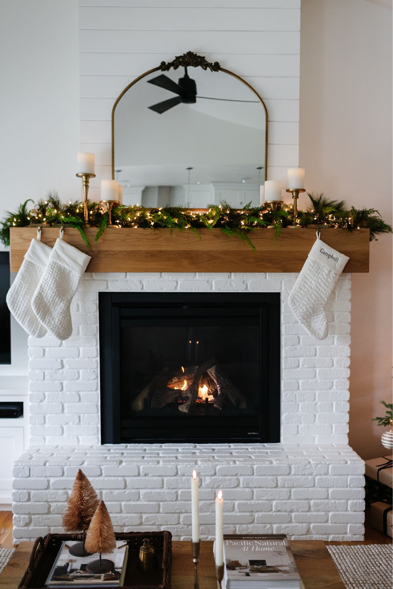 Mantel decor, Christmas decor, holiday decor, mantle decor, faux garland, battery candles, Christmas stockings, living room decor, vintage mirror, gleaming primrose mirror 

#LTKSeasonal #LTKhome #LTKHoliday