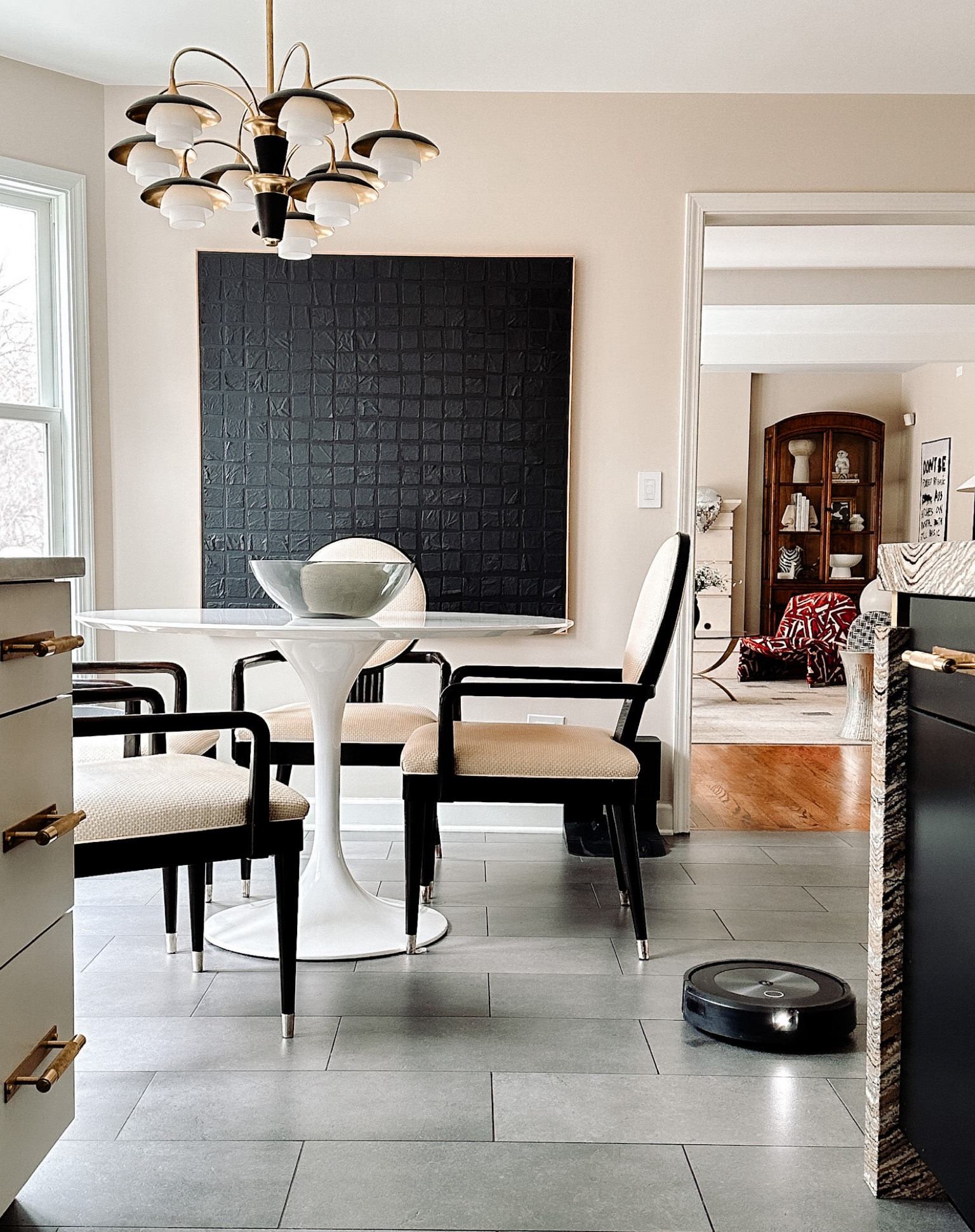 Top kitchen finds - I cannot live without my robotic vacuum cleaner (I love the self emptying Roomba). This white mid-century modern tulip table looks vintage, but it’s not and it’s the perfect size for our kitchen. And statement lighting. I love this art decor style chandelier in gold and matte black. The all black artwork is original but I tagged a few similar pieces by the same artist. 

#LTKstyletip #LTKover40 #LTKhome
