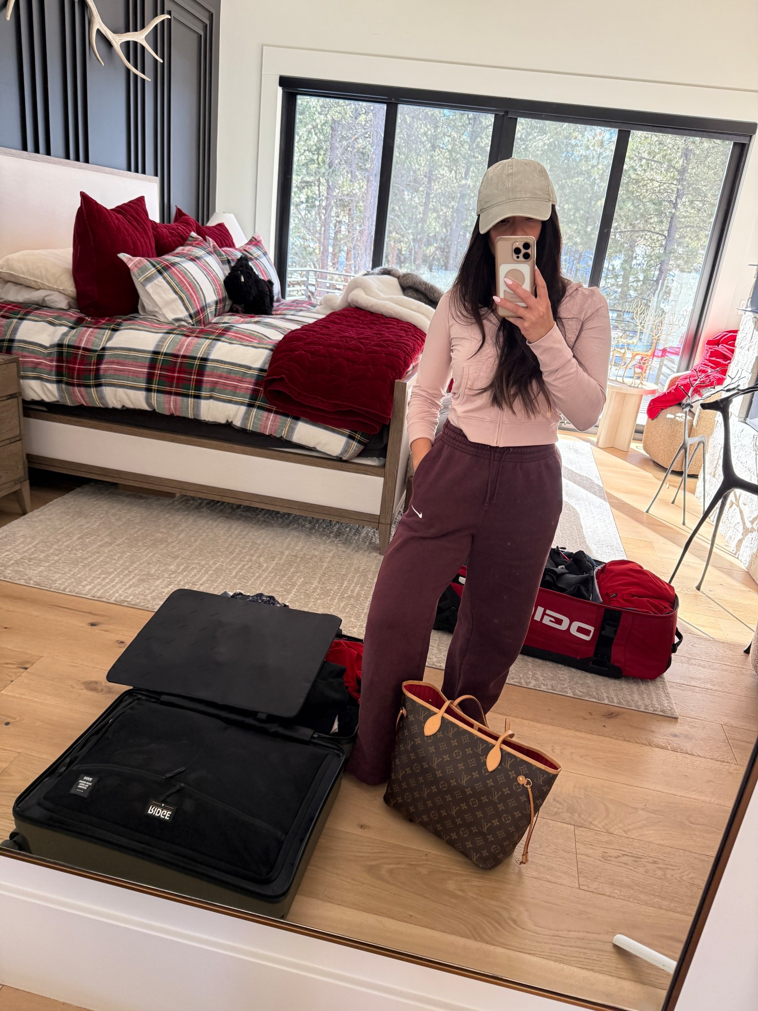 Packing for our ski trip. Wearing the pink Halo Mini full zip with my favorite wide leg sweats. This hat is so cute and goes with everything!

#LTKdayinmylife #LTKmomlife #LTKTravel