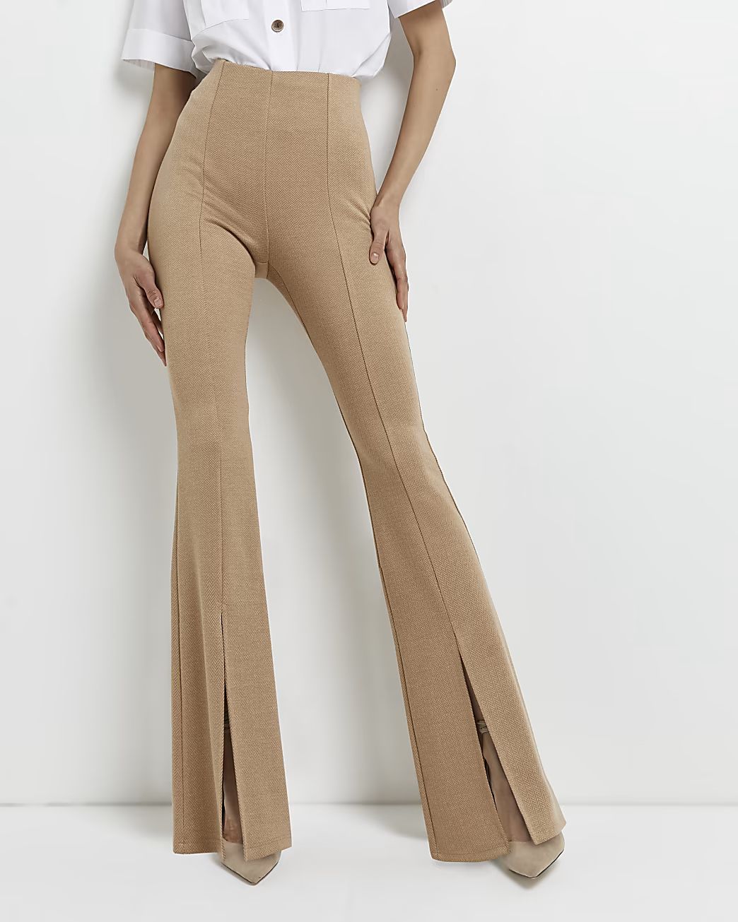 Beige split hem flared trousers | River Island (UK & IE)