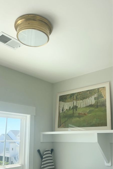 Laundry room light fixture and art 🤍 #laundryroom #serenaandlily #amazonfind #art 

#LTKhome #LTKfindsunder50