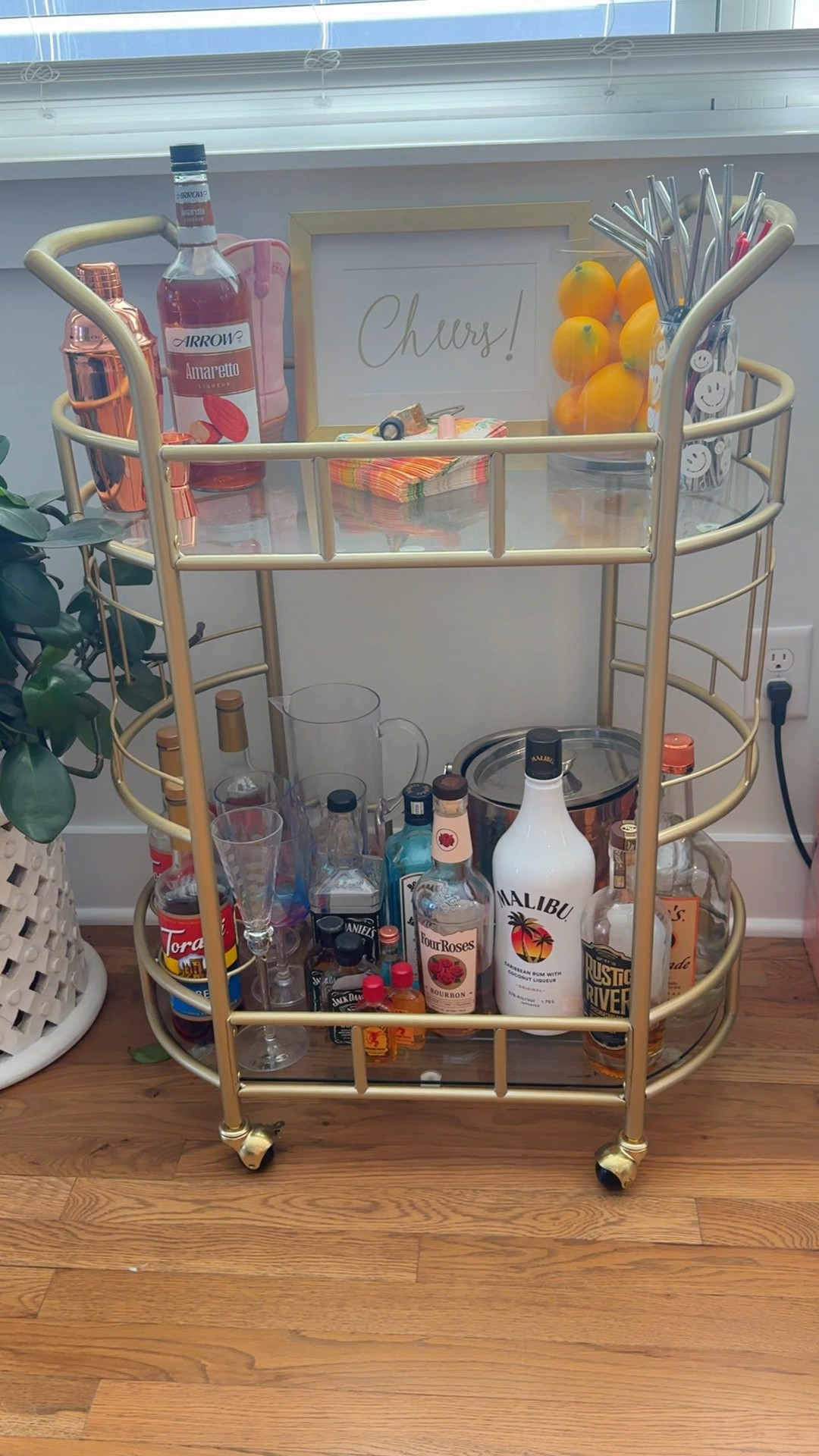 My favorite bar cart that I’ve had for two years now and it’s from Walmart!! Has two levels with glass shelves, holders to keep bottles in place and the cutest gold accents!!

bar cart, gold bar cart, home, bar finds, wine, storage, walmart finds, home accents

#LTKVideo #LTKParties #LTKHome