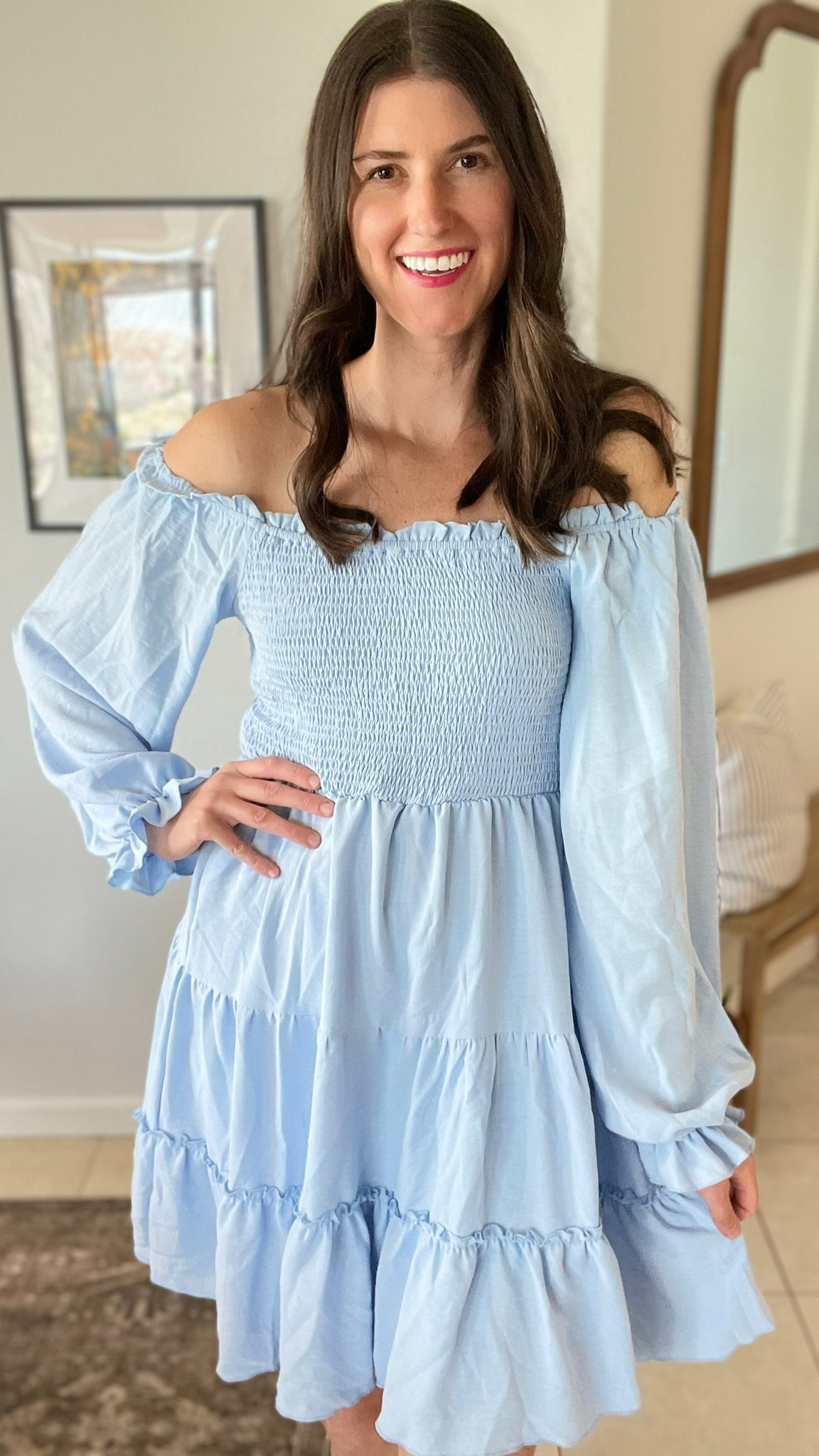 The prettiest off shoulder smocked dress. Long sleeves with ruffles. 

#LTKFestival #LTKOver40 #LTKFindsUnder50