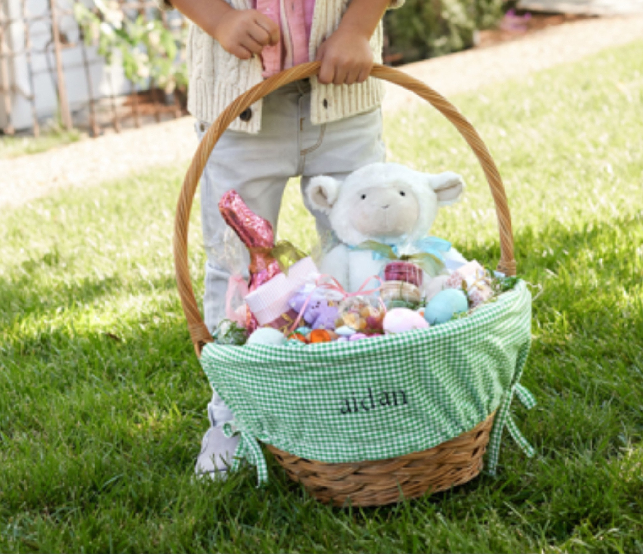 Easter-Bunny-approved basket ready for this year's hunt. Accented with a festive gingham check, plus cinch ties to hold the liner in place.

#LTKFamily #LTKSeasonal #LTKKids