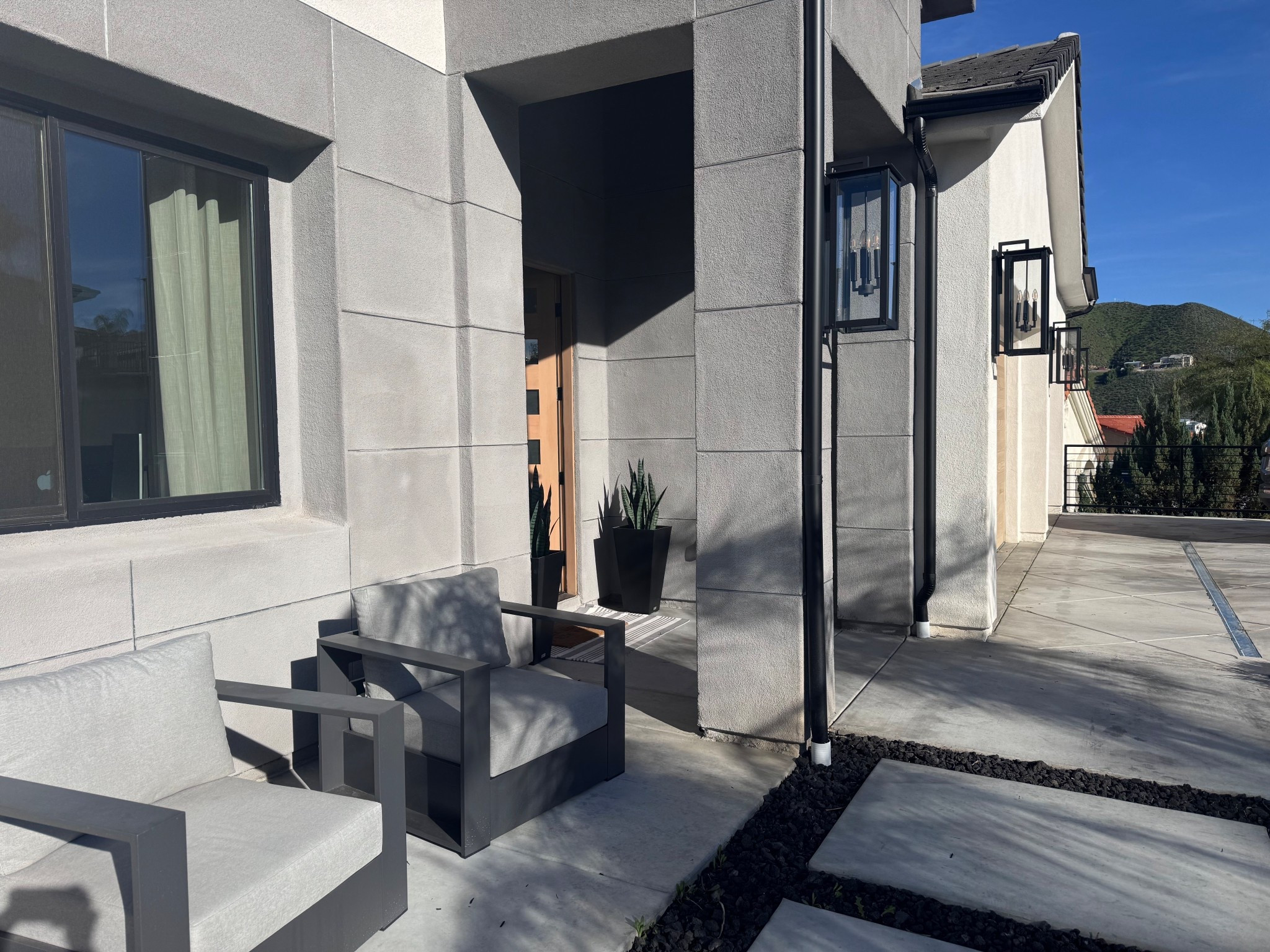 Front exterior | modern outdoor chairs | exterior oversized village lights | front door 

#LTKSeasonal #LTKstorytime #LTKHome