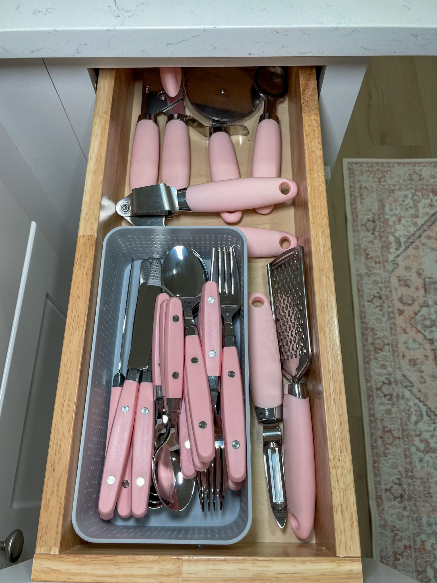 Even the utensils are pink — organized and ready for cooking.