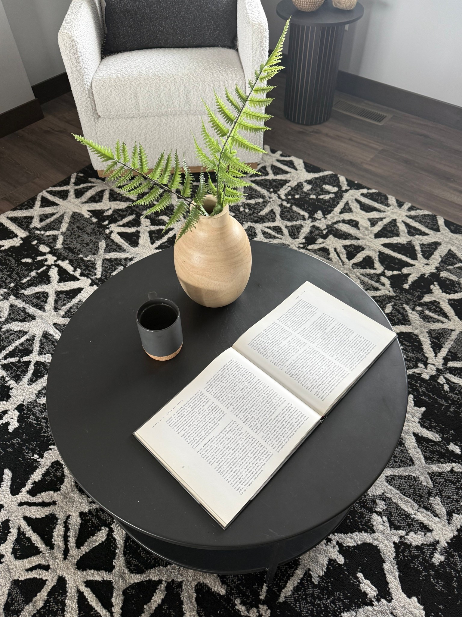 A black and cream living room moment 🖤 The bold contrast of the rug and coffee table paired with soft cream seating and natural wood accents keeps the space feeling warm, not stark. Shop the vibe here. 

#LTKHome