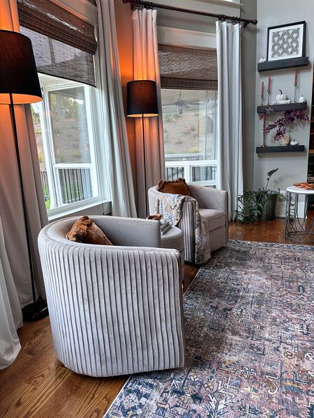 Living room fall-ing into the season 👏🏼🍁🕯️Loving these swivel chairs, floor lamps, and rug! 

#LTKhome #LTKSale #LTKfamily