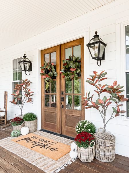 Front porch and door decor fall autumn harvest seasonal entry French double doors oversized layered scatter rug and doormat pumpkin magnolia trees faux artificial silk florals mums baskets wreaths outdoor lanterns wall sconces rocking chairs light fixtures southern modern farmhouse style home decor nearly natural amazon finds Etsy wayfair marshalls TJ Maxx home goods Walmart 

#LTKHalloween #LTKhome #LTKSeasonal