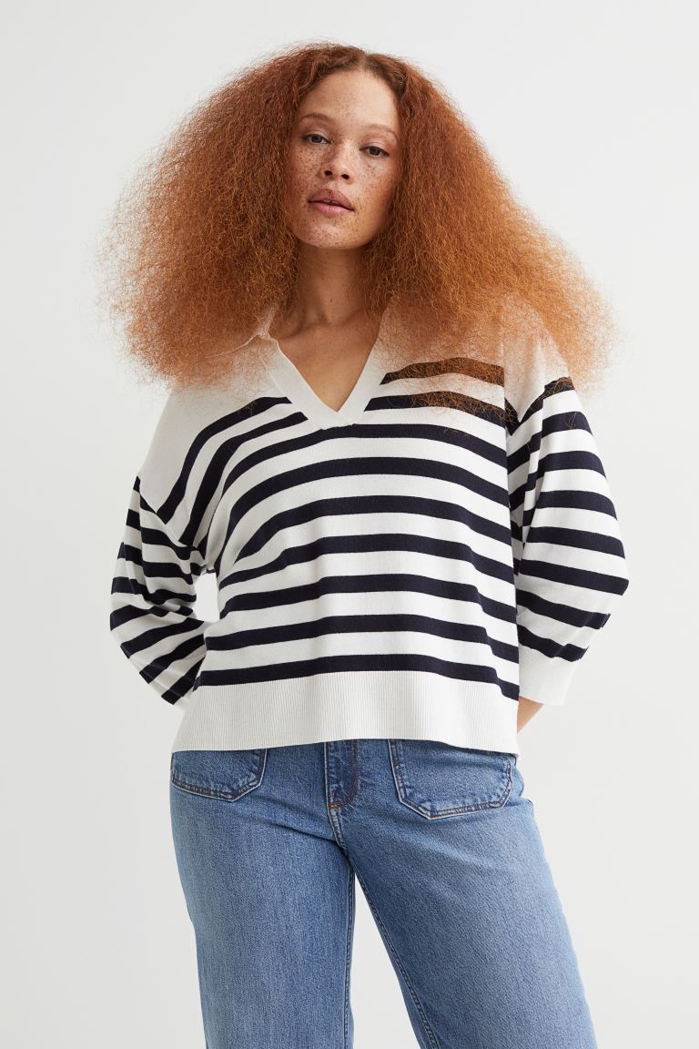 Soft, knit sweater with wool content. Collar, V-shaped opening at front, dropped shoulders, and w... | H&M (US + CA)