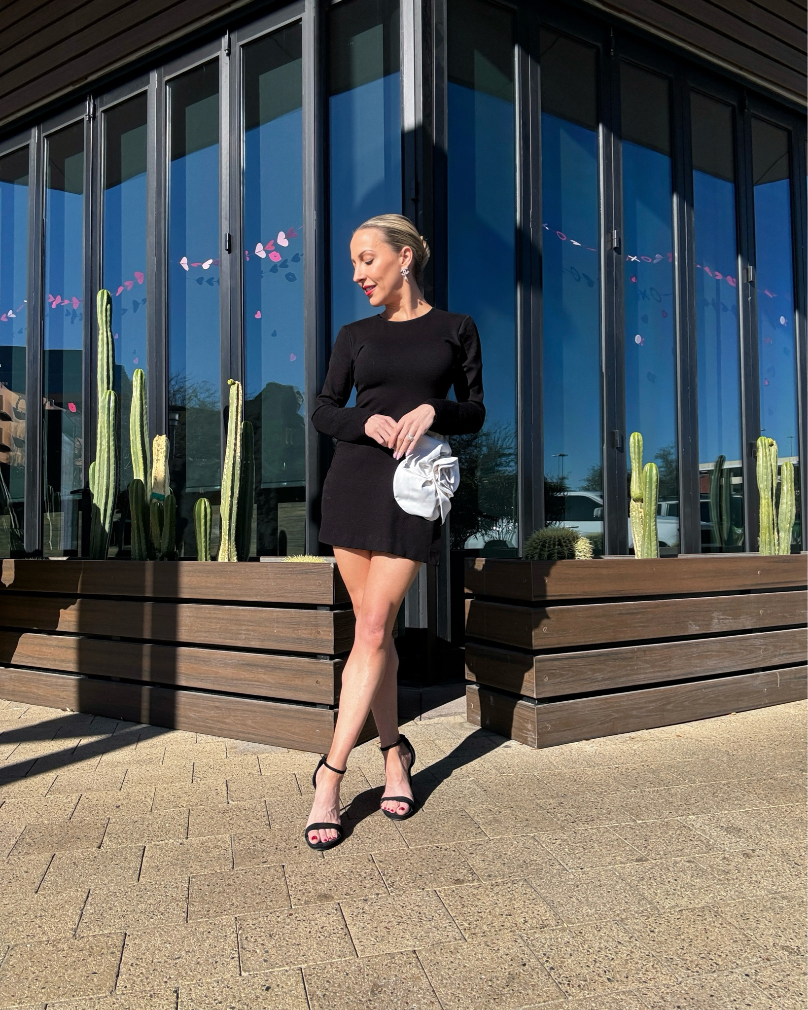 The prettiest little black dress I’ve seen! This long sleeve cut out black mini dress with its large white flower is chic but sexy and the perfect date night dress. 


#LTKwedding #LTKSeasonal #LTKparties