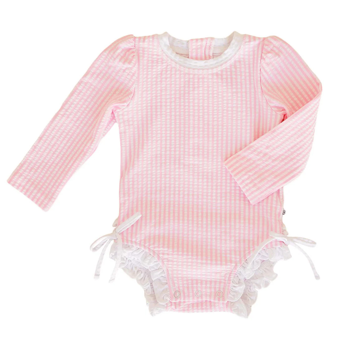 Long Sleeve Rash Guard With Ruffle Bottom | Seersucker Pink | Caden Lane
