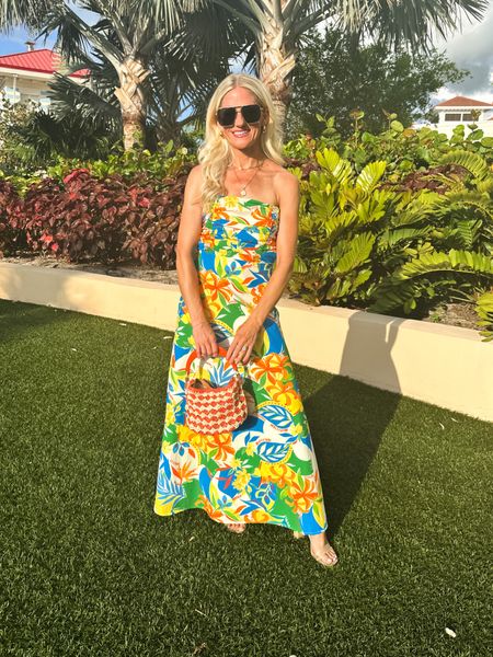 Tropical print vaca/summer dress! Dress is lined, has a ruched bust and zipper closure in the back with a cut out back. 

#LTKTravel #LTKStyleTip