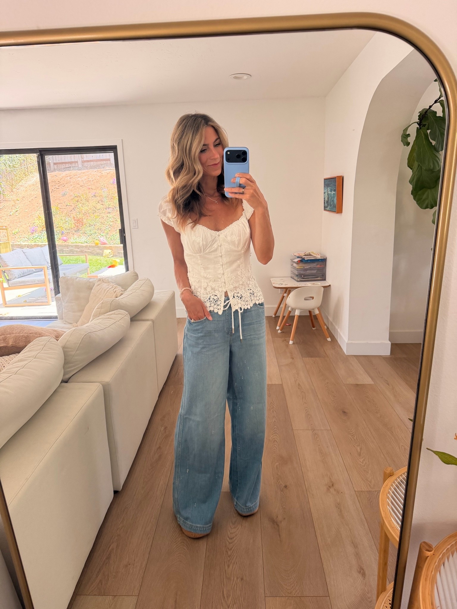 Beachy, effortless, and on sale 🤍🌊 cute travel outfit 
Use TENLEY40 on Vici endless summer sale! These are the kind of pieces you’ll wear now and keep reaching for into fall. The blouse is so pretty and feminine—I ordered a small because I was worried an XS would be too fitted through the bust, but I’d actually recommend your normal size. The drawstring pants are meant to have a relaxed, low-rise fit. I ordered my usual size 25 (the website suggests sizing down), and they fit great, but I probably could have worn a 24 too.

VICI’s Endless Summer Sale is happening now, and you can use my code TENLEY40 for 40% off!

VICI, VICI Endless Summer Sale, white eyelet blouse, white embroidered blouse, boho blouse, beachy outfit, coastal style, drawstring pants, wide leg pants, linen look pants, vacation outfit, travel outfit, resort wear, neutral outfit, effortless style, casual chic, Reef red wedges, summer to fall outfit.

#LTKdayinmylife #LTKootd #LTKOver40