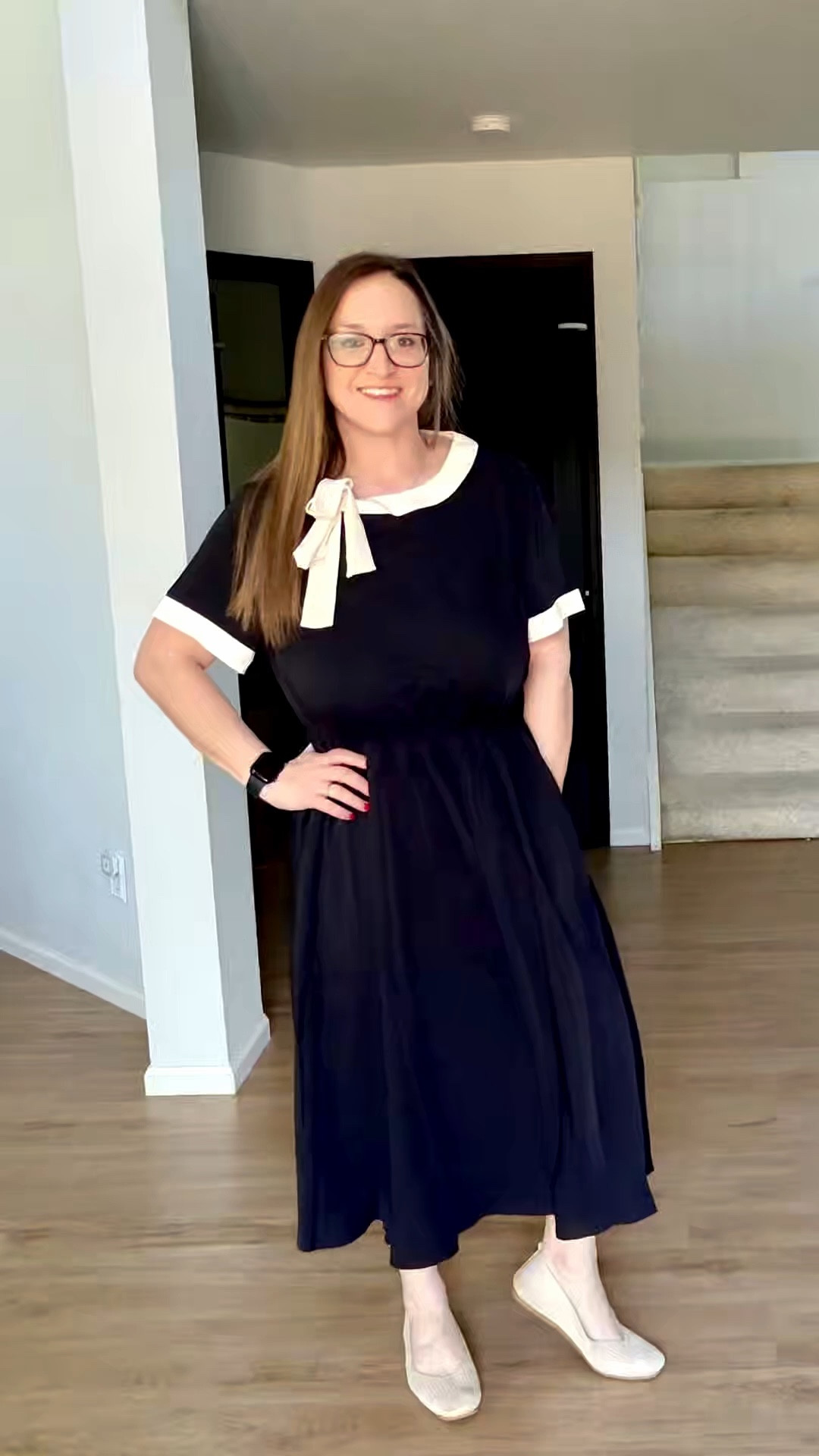 This black midi dress has the sweetest beige bow and matching trim on the sleeves. It’s a super lightweight material that just slips right over your head, and the stretchy cinched waist makes it easy to move in. It even has pockets and a flowy skirt that’s basically made for a good twirl.

#LTKPetite #LTKWorkwear #LTKootd