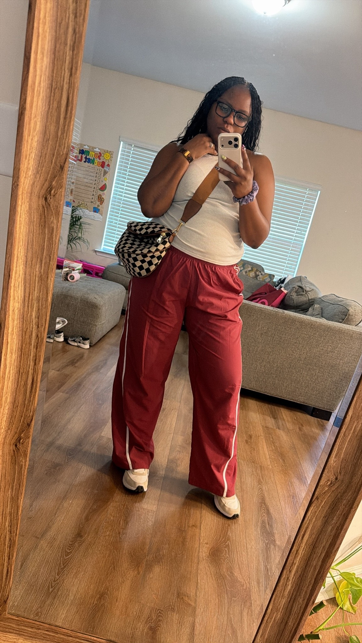 Casual comfort with a little edge 🖤 This ribbed tank + red track pants combo is giving off-duty athleisure vibes — throw on a checkered crossbody and white sneakers and you’re set for errands, travel days, or coffee runs. Effortless, comfy, and still put-together.

#LTKdayinmylife #LTKOver40 #LTKMidsize