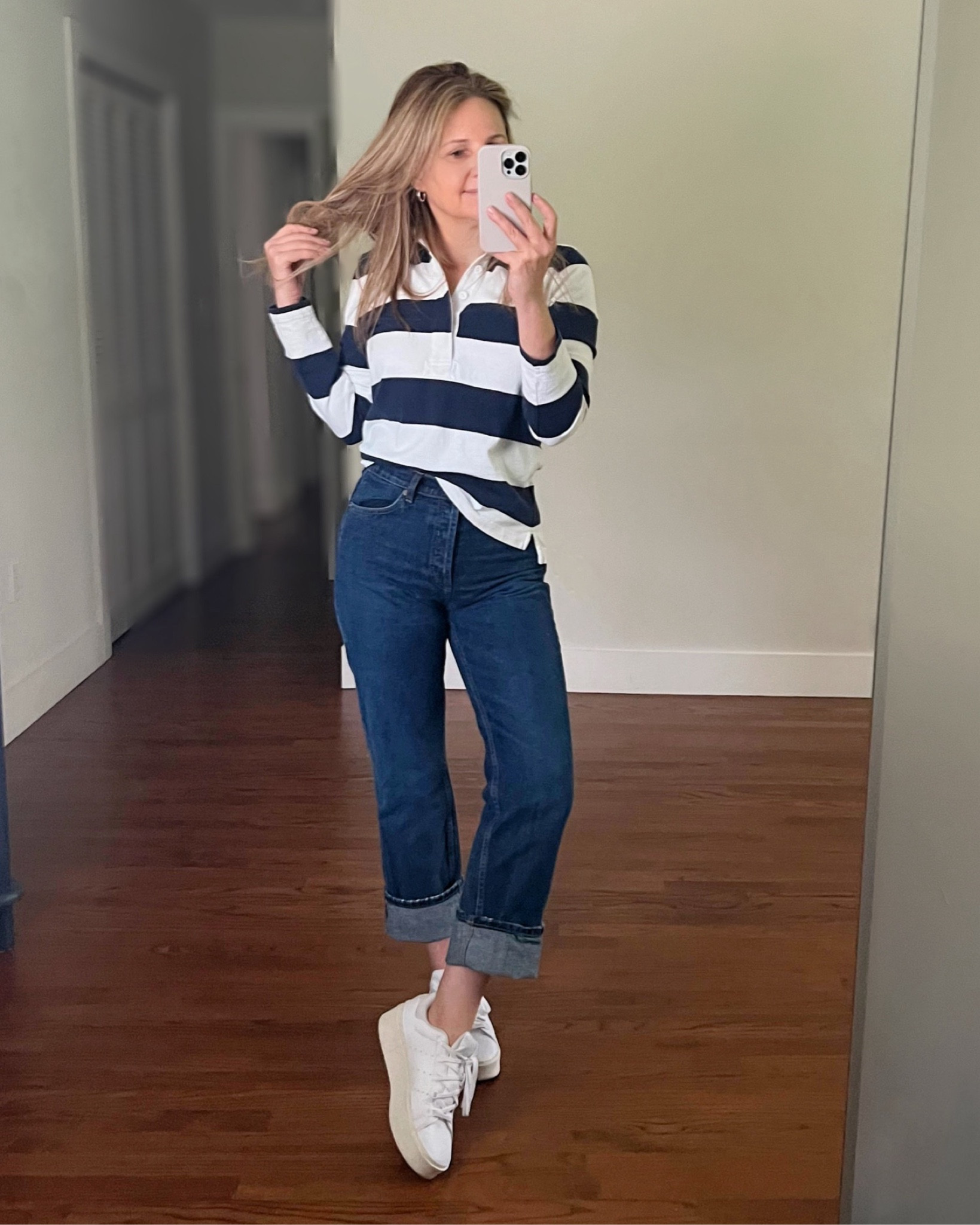 Retro style navy and white striped rugby long sleeve shirt with a pair of cuffed straight leg dark wash jeans and white Adidas Stan Smith  sneakers. 

Casual outfit, weekend outfit, teachers outfit, game day outfit, everyday outfit, jeans outfit, retro outfit

#LTKshoecrush #LTKover40 #LTKstyletip