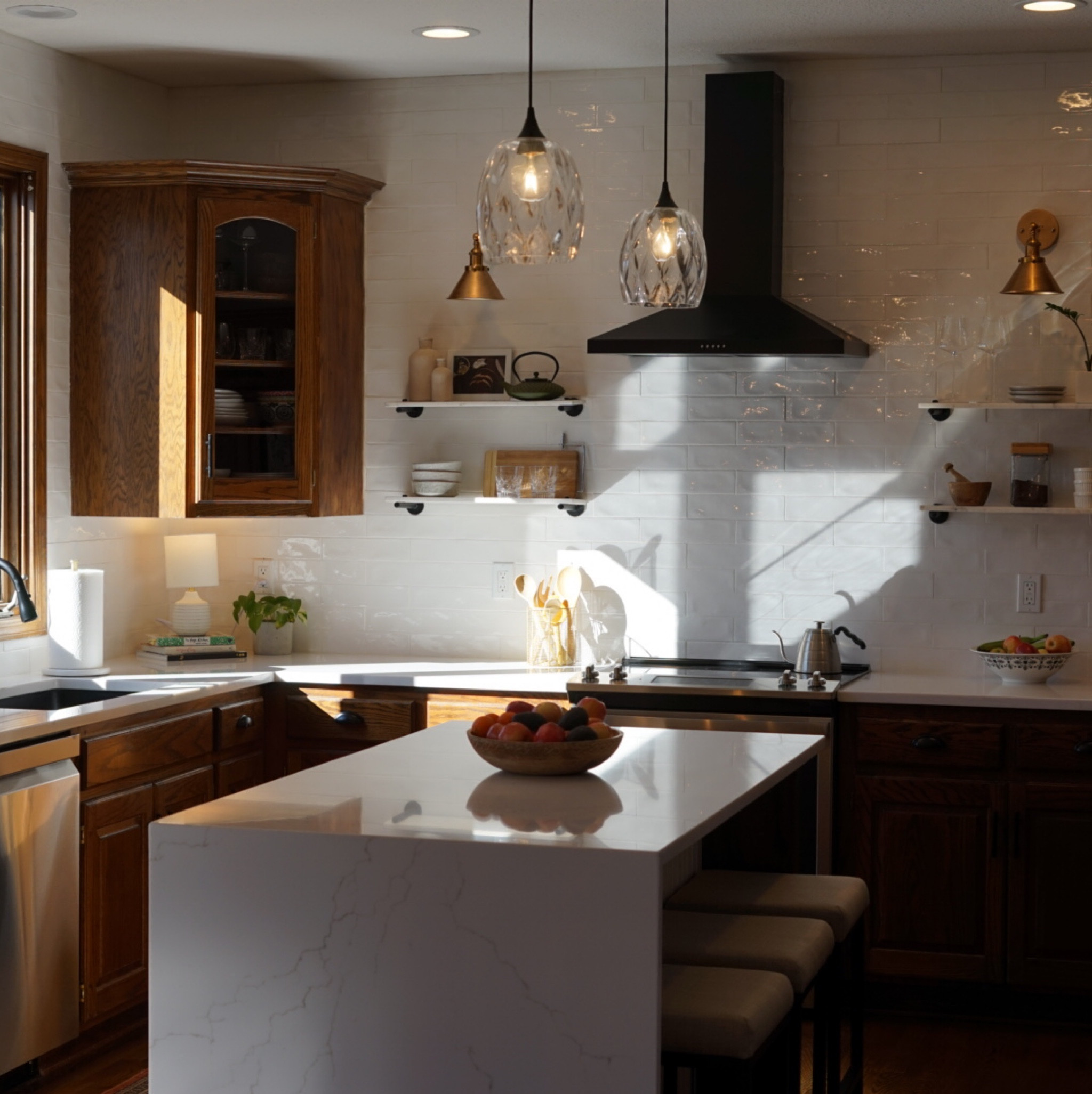 Above the island lighting, no hardwiring needed! You can screw these into your already existing light. We spray painted the bronze wire and plate black to match the rest of our kitchen hardware. A definitely doable DIY!

#LTKhome