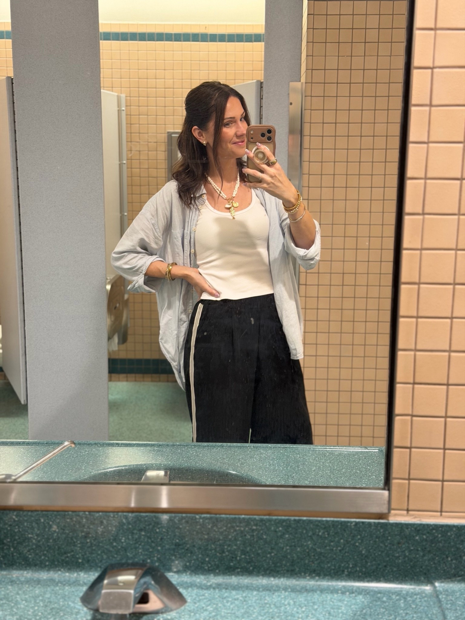 Pants are true to size but can run long, they were perfect on my 5’9” frame. I LIVE in this cropped tank during the summer. I’m wearing a medium. The oversized linen button down is a fave I have this light blue and also ivory. I wear as a bathing suit coverup too. It washes well but does wrinkle FYI. I’m in a small. This necklace is a new favorite find. So affordable and the fish is double sided and has some weight to it so it stays straight down and the necklace doesn’t twist. Also linked up my travel bag/purse and scarf I used to tie in the blue.

#LTKootd #LTKTravel #LTKSaleAlert