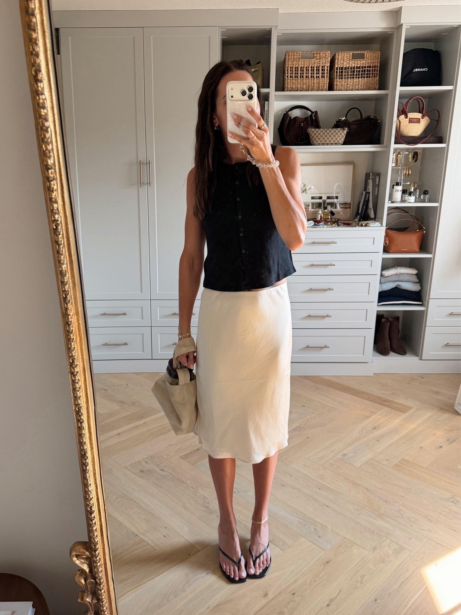 This satin slip midi skirt just got added to the NSale today 😍 true to size (S)
Tank: true to size (S)

#LTKSaleAlert #LTKWorkwear #LTKSeasonal