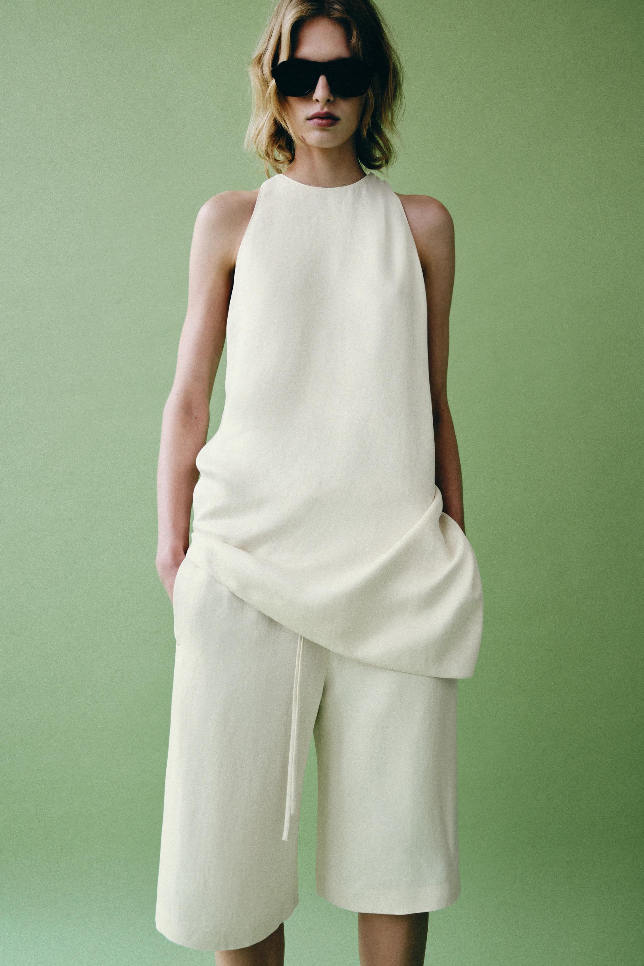 ZARA WOMAN COLLECTIONTop made with 14% linen blend yarn. Round neckline and racerback. Asymmetric... | Zara US