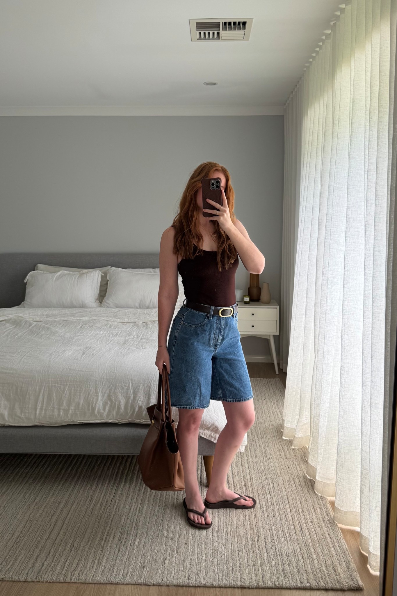 Today’s casual summer ootd, ft. one of my favourite comfy trends – the denim bermuda short.

I’m wearing the Witchery shorts in a size 8 AU and the DISSH brown tank top in a size XS.

#LTKsummer #LTKaustralia