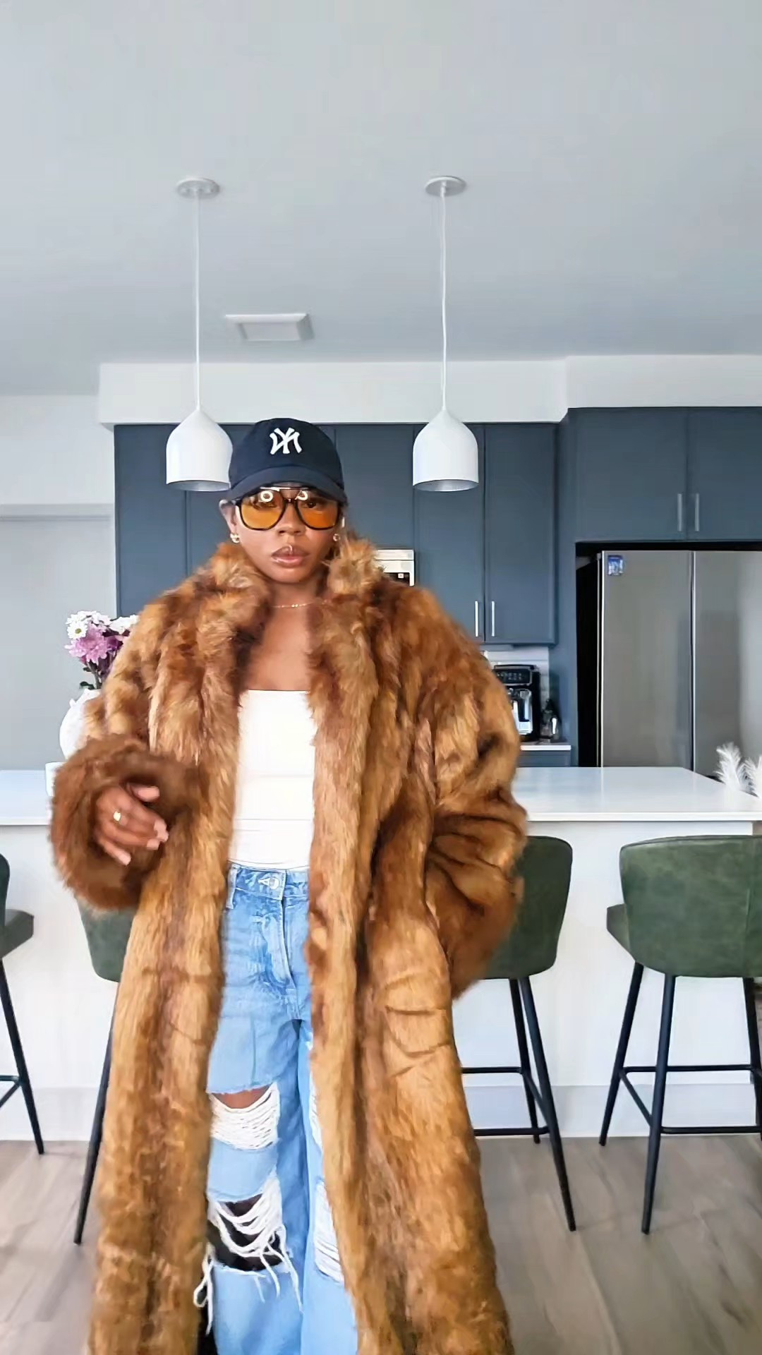 When Street Meets Chic I love a good street style look! This street fashion look is all about contrast. A bold faux fur, floor-length maxi coat styled with distressed denim jeans and everyday footwear for a comfortable, chic street wear moment that actually feels wearable. The relaxed denim tones down the drama of the coat, making the look effortless instead of overdone and perfect for real life, not just the camera.Styling tip: When wearing a floor-length maxi coat, keep your layers simple and slightly oversized underneath. Distressed denim adds texture and edge, while letting the faux fur stay the main character without sacrificing comfort.Faux Fur, Maxi Coat, Street Style, Sizing: Small

#LTKgrwm #LTKPetite #LTKootd