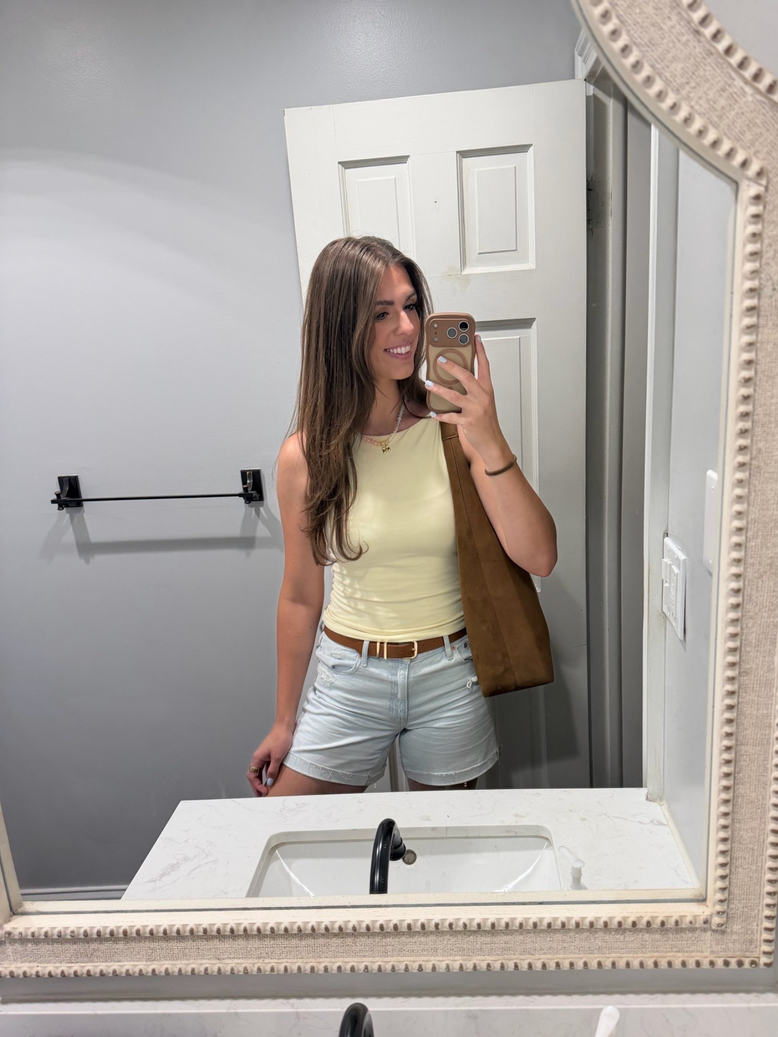 An effortless summer outfit made up of classic basics you’ll wear over and over. This look pairs a fitted yellow tank with high-waisted denim shorts, a brown leather belt, and a suede tote for an easy everyday outfit that feels timeless.

Perfect if you’re looking for casual summer outfits, women’s everyday outfits, yellow tank tops, high-waisted denim shorts, neutral summer style, capsule wardrobe essentials, brown suede tote bags, weekend outfits, mom style, and affordable fashion finds. These versatile pieces mix and match with almost everything in your closet.

#LTKdayinmylife #LTKootd #LTKmomlife