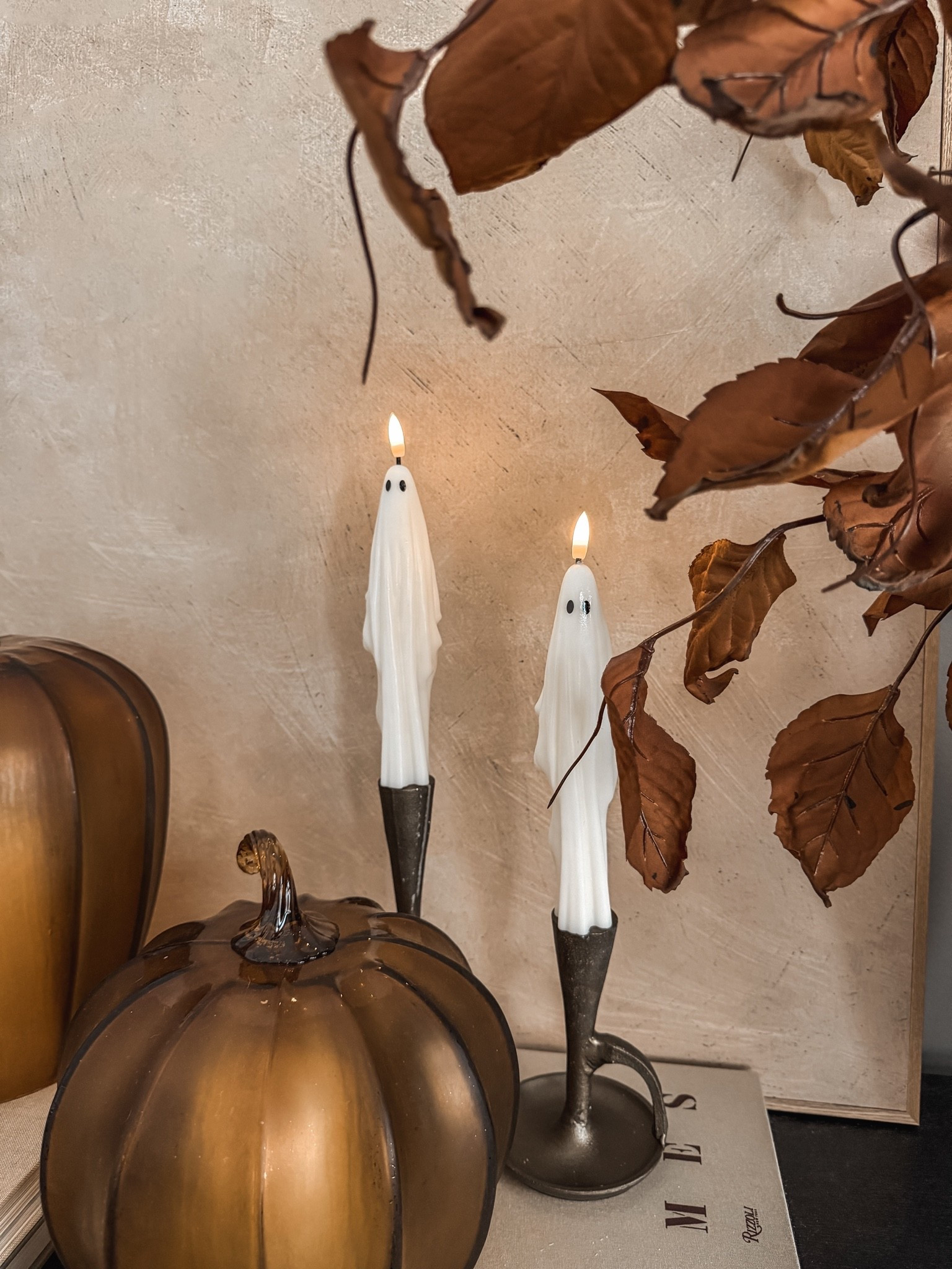 Spooky season, but make it cozy 👻🤎 Still love love love these ghost taper candles!! They’re flameless & have an on/off timer!

ghost taper candles, Halloween candles, ghost candles, flameless Halloween candles, elevated Halloween decor, cozy Halloween decor, neutral Halloween decor, vintage Halloween decor, classy Halloween decorations, subtle Halloween decor, fall home decor, autumn home decor, cozy fall decor, amber glass pumpkins, glass pumpkin decor, Halloween home finds, spooky season decor, Halloween tabletop decor, fall styling ideas, cozy home finds