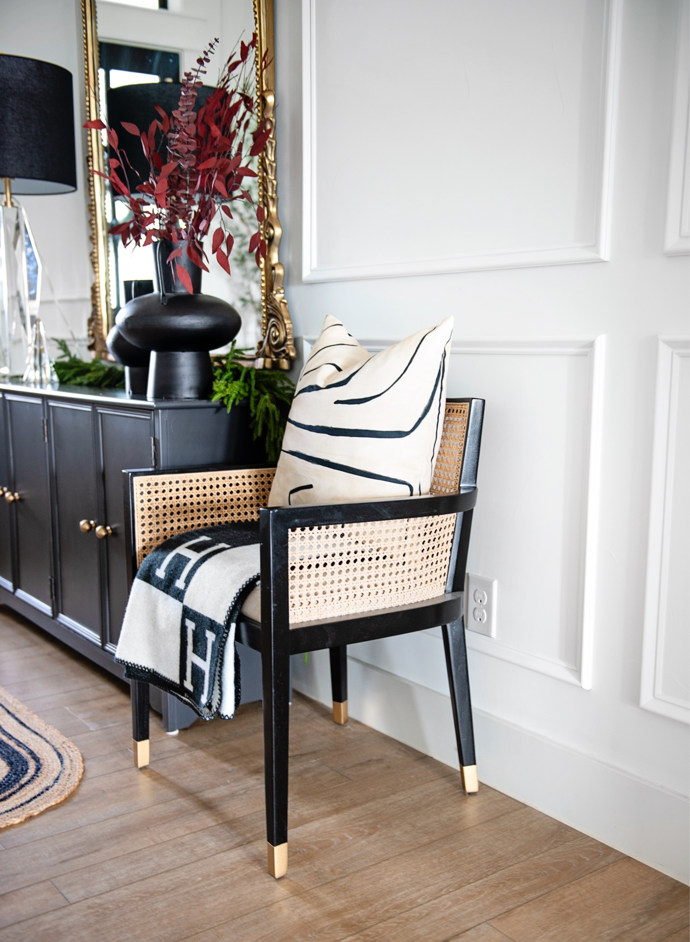 Living room decor, entryway, Anthro mirror, home, decor, modern pillows, modern chair, accent chair, cane furniture, BoHo, rattan, black cabinet, affordable furniture, flower, vase, holiday, decor, Christmas, decor, Christmas garland,

#LTKHoliday #LTKhome #LTKSeasonal