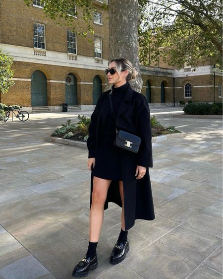 All black outfit - mango black belted coat, black knit jumper worn as a dress, Celine triomphe handbag, sunglasses and black loafers  

#LTKeurope #LTKstyletip #LTKSeasonal