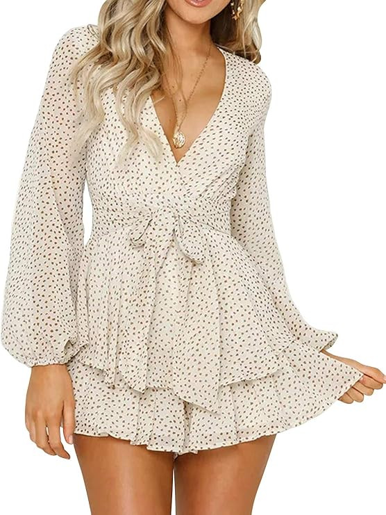 MILLCHIC Women's Polka Dot Deep V-Neck Long Sleeve Knot Front Ruffle Hem Romper Jumpsuits | Amazon (US)
