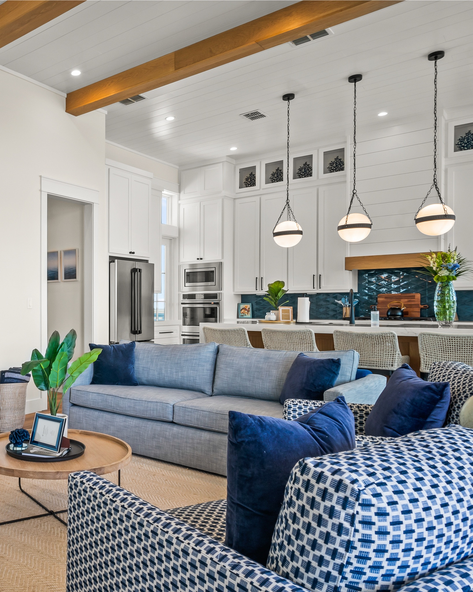 Navy blues, natural light, and views for days. 🌊 This coastal living room doesn’t just make a statement—it makes waves. Finished with boldly beautiful patterned chairs that anchor the space in effortless elegance.

#livingroom #interiordesign #homedecor #livingroomdecor #livingroominspo 

#LTKTravel #LTKSeasonal #LTKStyleTip