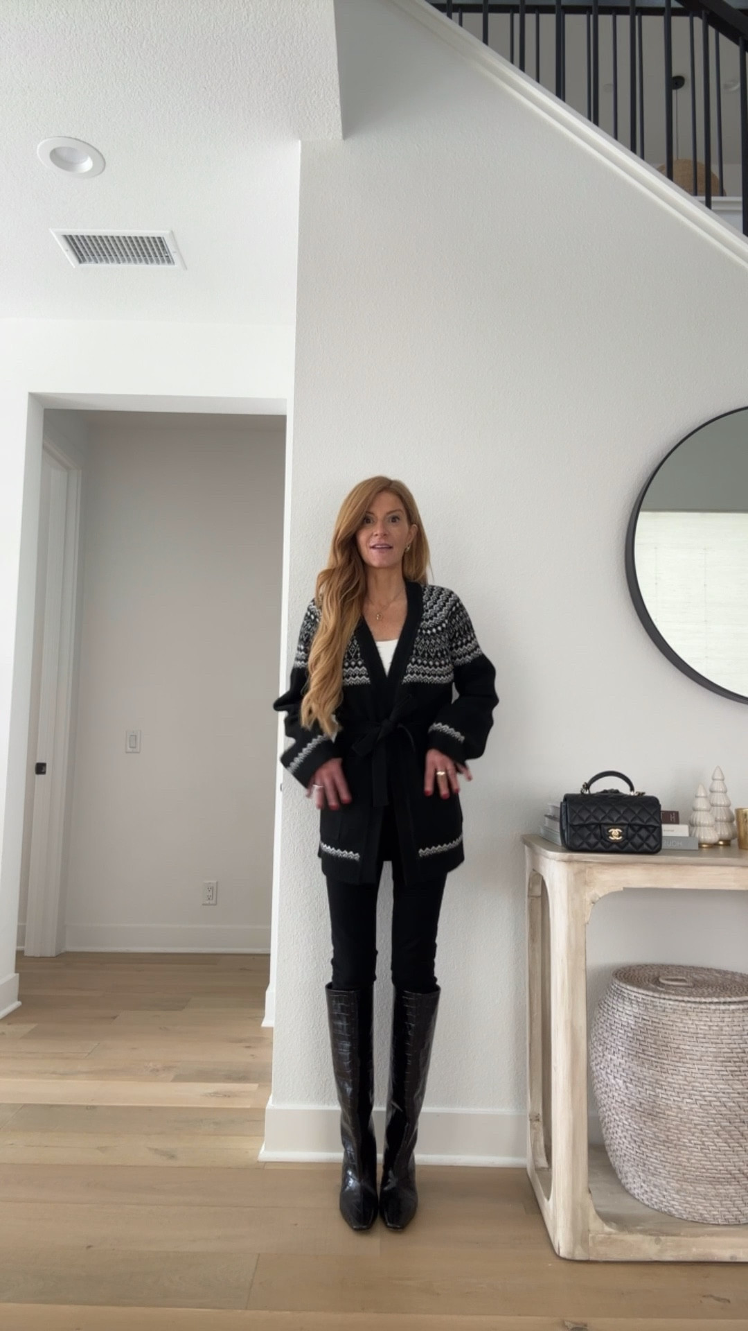 Cozy cardi tie waist black and white love it so much! Wearing xs skinny jeans (a must for tucking into boots) 

#LTKHoliday #LTKFindsUnder100 #LTKSeasonal