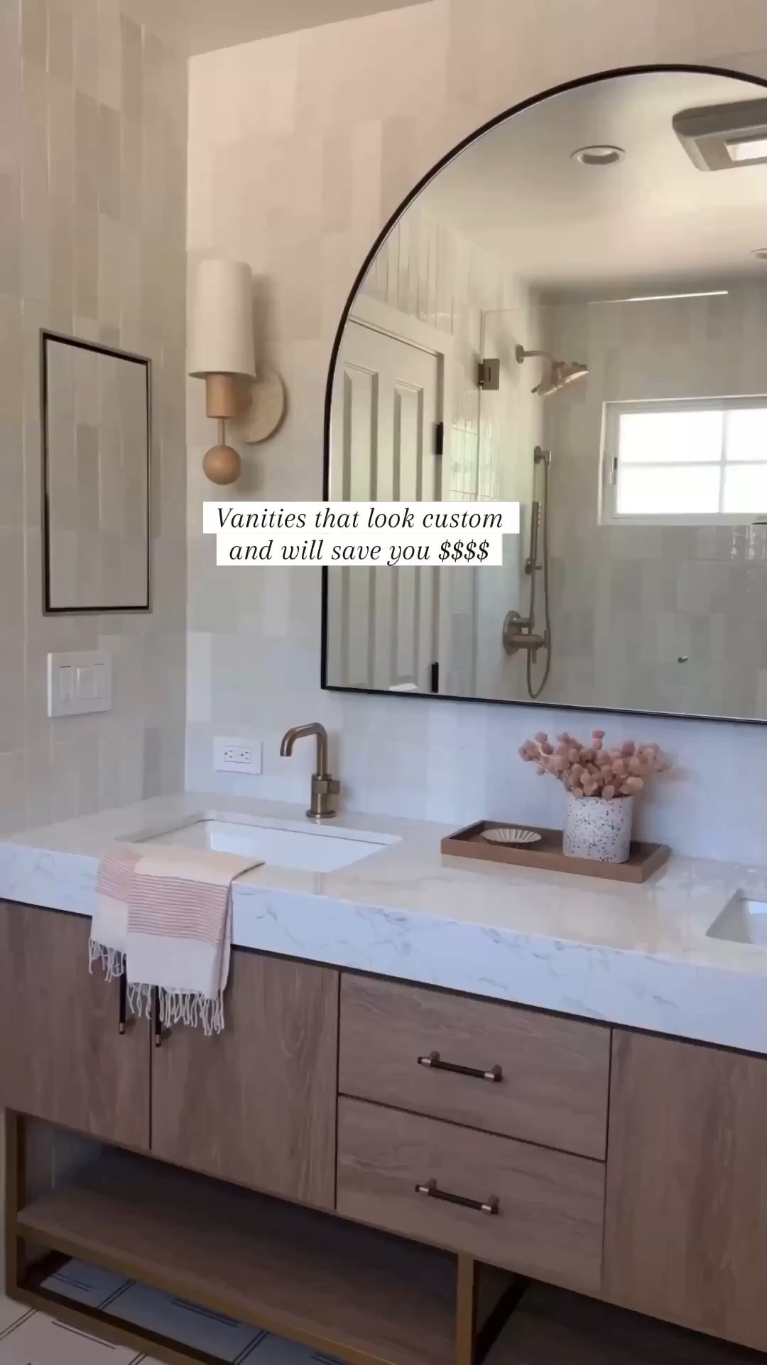 These vanities so look custom and have saved our clients so much SS$$.
Anytime you can buy a vanity with. Countertop you'll save thousands since you don't have to buy a countertop plus pay for fabrication.

#Wayfair

Wood vanity oval capsule, mirror, rectangle, mirror, medicine cabinet, brass faucets, brass hardware, bra, shower system, white soaking tub bra, sconces, bubble chandelier, bathroom, accessories, white tile, gray tile marble tile sink rug runner

#LTKSaleAlert #LTKHome