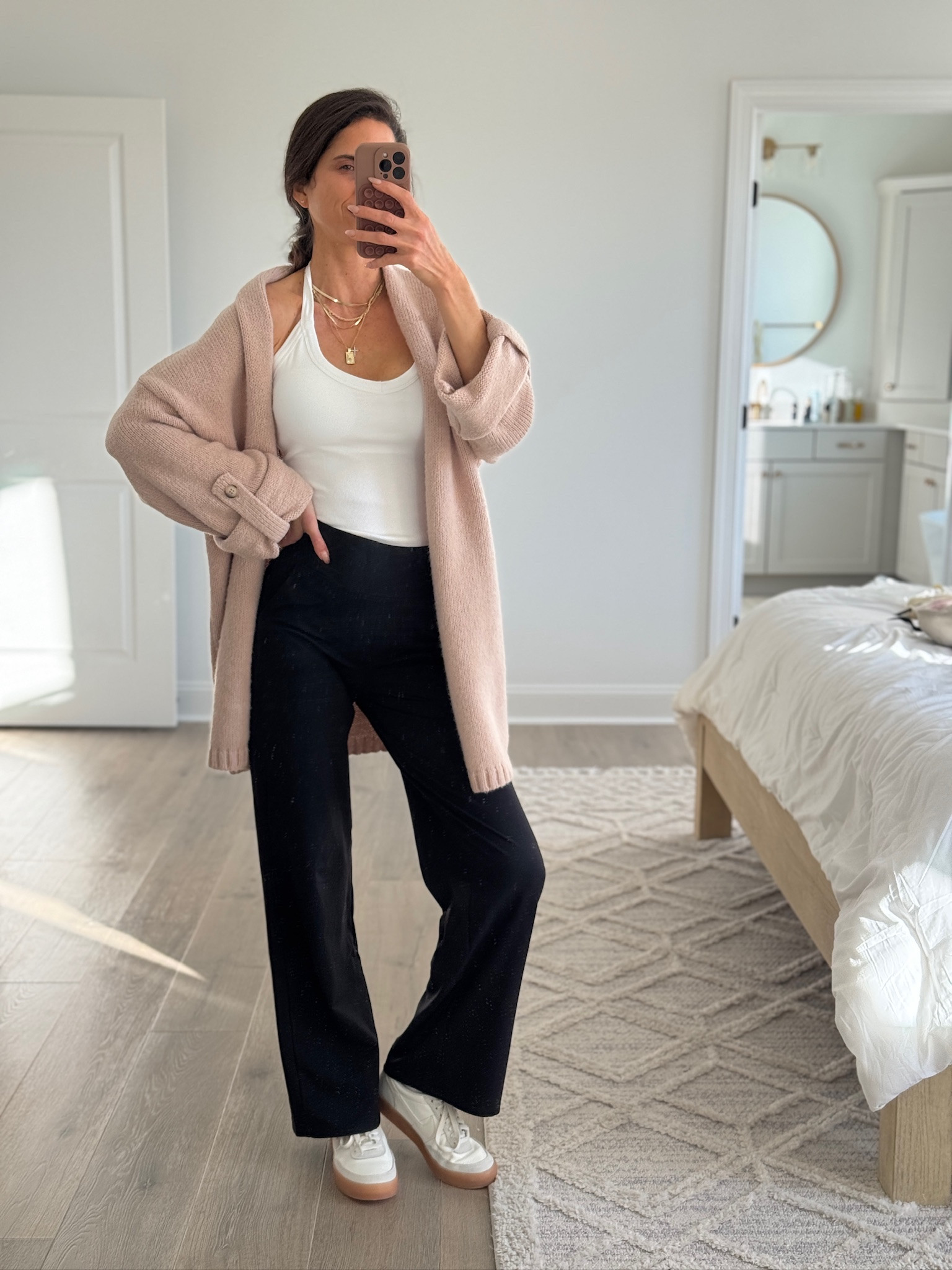 Easy everyday outfit built around comfortable basics. Soft open-front cardigan layered over a fitted tank with relaxed wide-leg pants and comfortable sneakers. Perfect for errands, travel days, or casual everyday wear when you want something cozy but still put together. Neutral pieces that mix and match effortlessly.

Casual outfit, everyday outfit, neutral outfit, cozy layers, open front cardigan, wide leg pants, comfy outfit, casual chic style, mom outfit, affordable fashion

#LTKootd #LTKFindsUnder50 #LTKSeasonal