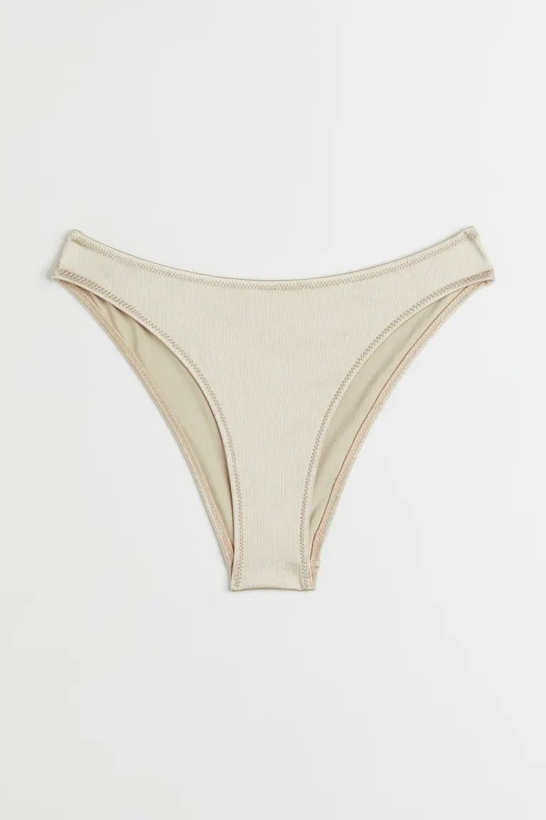 Conscious choice  Fully lined bikini bottoms with a textured finish. Regular waist and cutaway co... | H&M (US + CA)