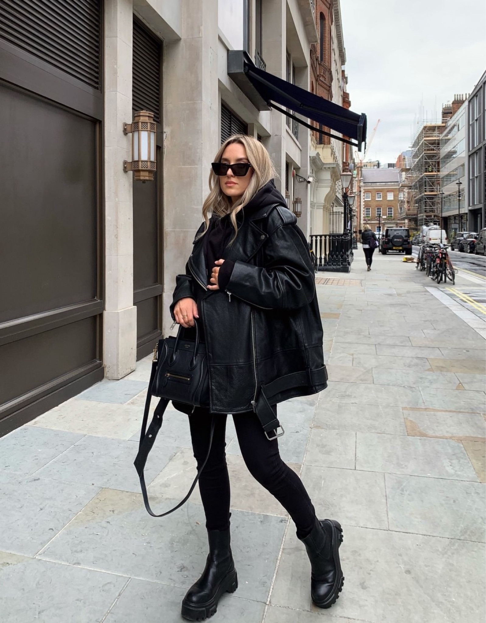 All Black Autumn Looks 06 - the most basic casual look, hoodie and skinny jeans, elevated with a statement oversized leather jacket, chunky black boots and sunglasses and Celine handbag

#LTKautumn 

#LTKstyletip