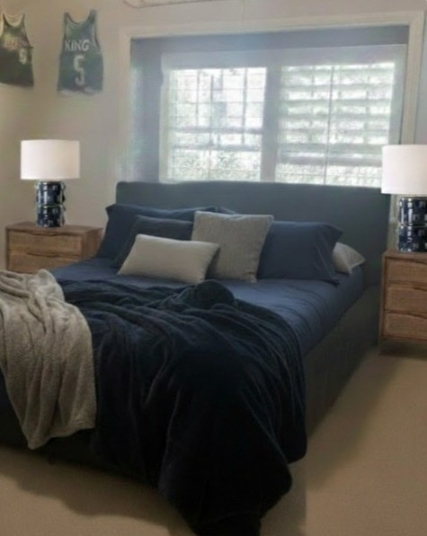 Teen Bedroom – Blue + Grey with a Classic Twist

A playful, slightly quirky layout designed to maximize function without losing personality. By positioning the bed against the window seat, we created space for a larger dresser to support gaming needs, added two substantial nightstands, and introduced more practical storage throughout the room. A display of favorite sports jerseys adds a personal, energetic layer that makes the space feel truly his. The palette blends calming blues and soft greys with a traditional dark wood twist — a subtle nod to classic East Coast style and tailored, suit-inspired textures that keep the room feeling grounded, timeless, and mom-approved while still feeling like a true teen retreat. 

 #LTKHome