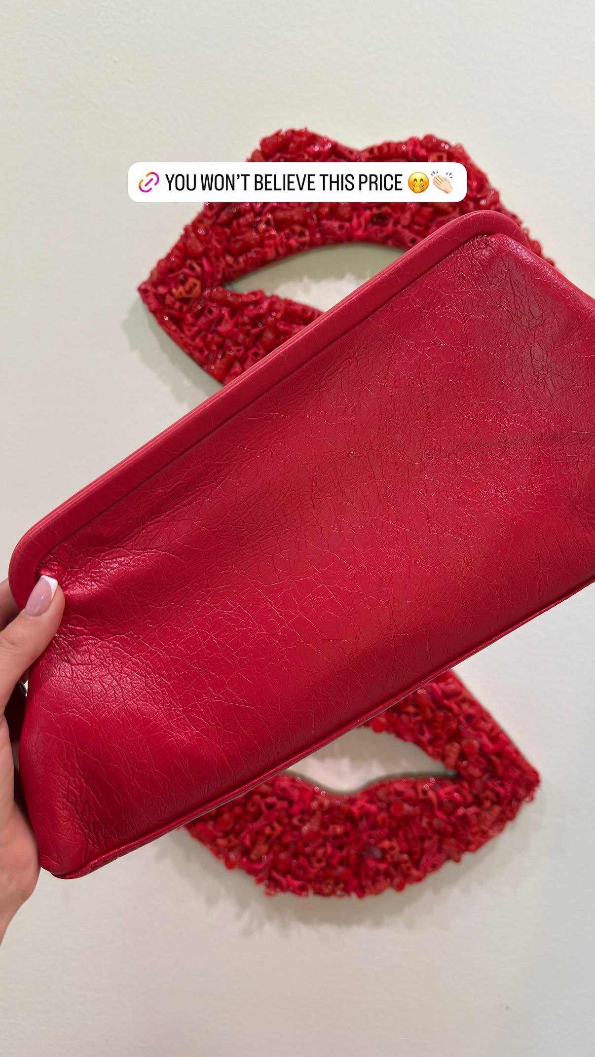 A red bag is not a statement. It's a strategy.
Topshop's Anna Clutch is $49, angular, structured, and the exact shade of red that works year-round — not holiday red, not Valentine's red, just a clean true red that makes a white linen outfit look intentional and a black dress look less predictable.
The medium size is the right call on this silhouette — big enough to actually function as a clutch for a real night out, angular enough to photograph well in every direction. At $49 it's the color commitment that costs nothing to try and pays off every single time you carry it.
Wear it with neutrals and let it be the only thing happening. That's the whole styling note. 

 