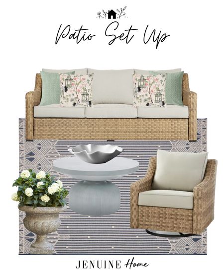 Outdoor patio. Patio set up. Neutral outdoor seating. Traditional outdoor seating. Swivel outdoor armchair. Navy and white striped outdoor rug. Cement look planter pot. Cement lo coffee table. Wavy ceramic decor bowl. Chinoiserie outdoor pillow. Light Green outdoor pillow  