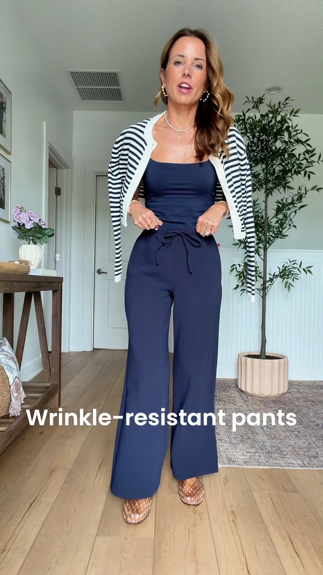 My summer outfit of the day! Elevated casual outfit. Mom outfit. Europe outfit. Business casual. Travel outfit. Aritzia wrinkle resistant wide leg pants in XS short. Aritzia striped cardigan in 2XS. Amazon cami in XS. Jelly ballet flats are whole sizes only - I sized down to a 6 per reviews and am usually a 6.5.

#LTKootd #LTKgrwm #LTKTravel