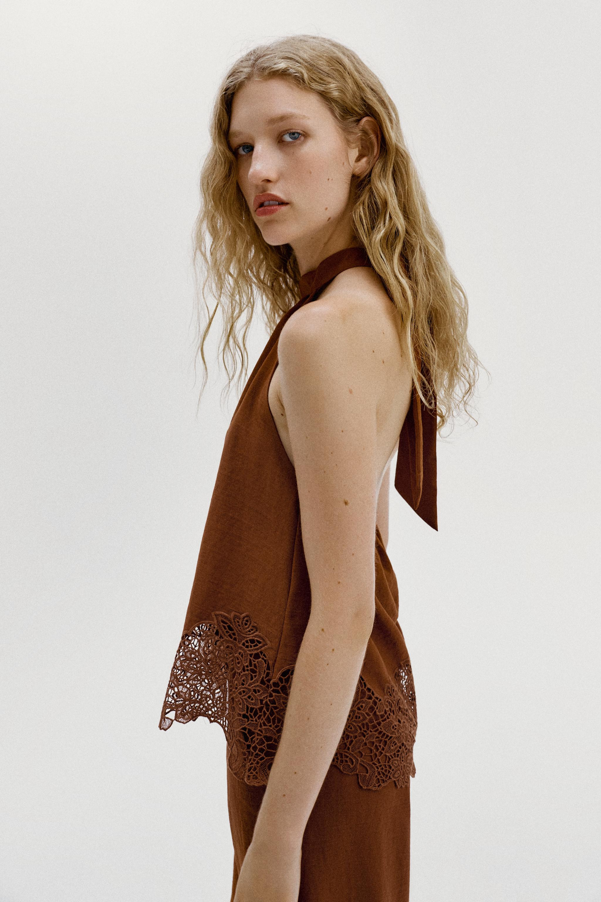 Halter-neck top with a tie fastening at the back. Features matching embroidered eyelet detailing ... | Zara US
