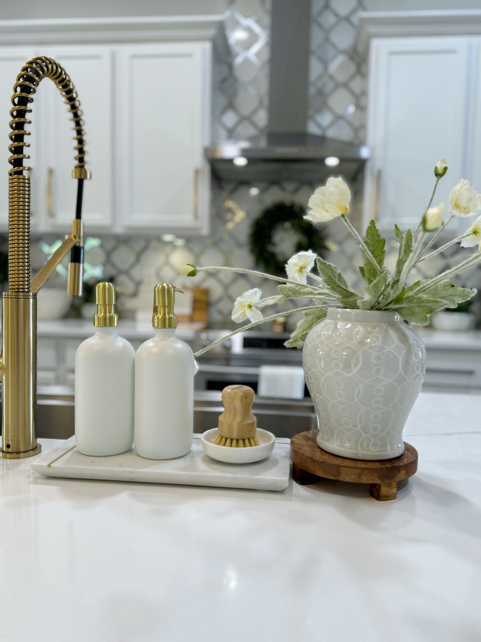 I recently gave my kitchen sink a refresh. Here are all the items I used. The quality of the Soap Dispensers…just amazing!!! The faux florals are soooo pretty! 

#kitchendecor #kitchensink #homedecor #homestyling 

#LTKSaleAlert #LTKHome #LTKVideo
