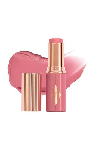 Charlotte Tilbury Unreal Lip + Cheek Glow Blush Stick with Hyaluronic Acid in Rosy Glow. | Revolve Clothing (Global)