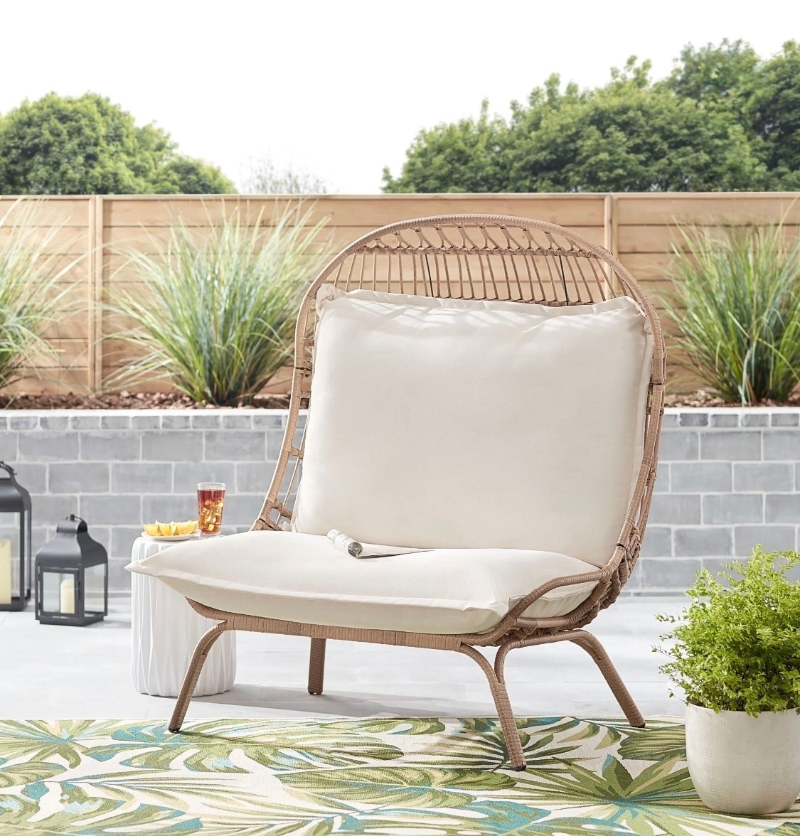 The Better Homes & Gardens Willow Sage Steel Wicker Cuddle Chair, Natural is lounge-ready with a wide seat and high back, adding instant statement and comfort to your outdoor patio. This lovely outdoor cuddle chair offers plush seating, with seat and back cushions that feature a durable off-white solution-dyed polyester with polyester 3M Scotchgard™ treated fabric and weather-resistant fiberfill. Designed with hand-woven decorative details, the natural wicker is perfectly wrapped over a strong rust-resistant steel frame that has been UV-treated, powder-coated for a long life of outdoor use. A rust-resistant finish creates the perfect spot to enjoy the weather, pleasant conversation, an outdoor gathering, and more. Neutral tones match almost any outdoor Décor style. The Better Homes & Gardens Willow Sage Outdoor Wicker Cuddle Chair will make a welcome addition to your patio, porch, lanai, or garden.

#LTKHome #LTKSeasonal #LTKselfcare