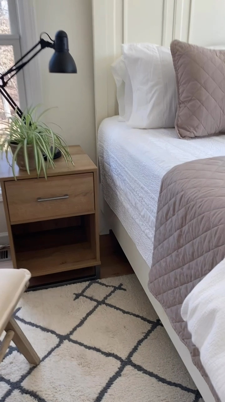 ✨ Bedroom Sneak Peek!✨  

My new bedroom is coming together, and I’m loving the cozy, neutral vibes! 🤍 Mixing warm tones with classic black and white for a timeless look. Just added a beautiful natural wood nightstand, a taupe diamond quilt + shams, and a black adjustable lamp for contrast. 🖤 A comfy side accent chair is in place—perfect for relaxing!  

Next up: a new rug, artwork, and possibly an accent wall to add even more character. Stay tuned for the final reveal! 🏡✨  

✨ The bed quilt set is on sale!✨

#BedroomDecor #NeutralHome #CozySpaces #TodaysHome #HomeInProgress #InteriorInspo #HomeDecorDeals

#LTKMostLoved #LTKHome #LTKSaleAlert