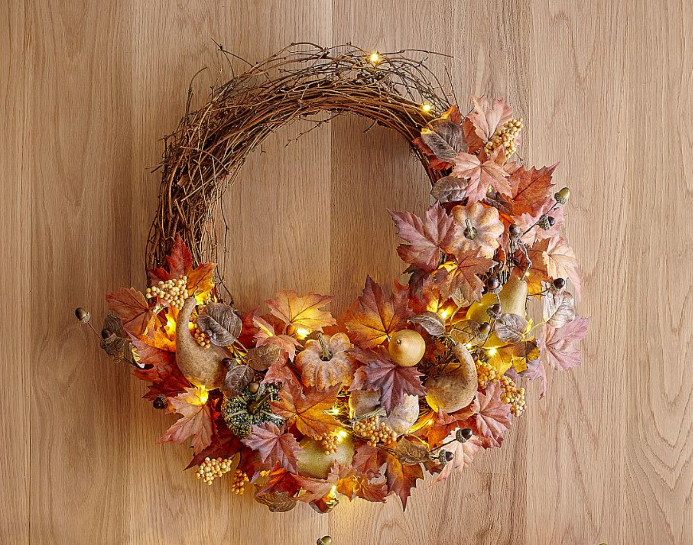 Going Fall! This wreath is bigger (24" diameter) and lights up and has a matching garland for the table. 

 #LTKSeasonal #LTKHome #LTKSaleAlert