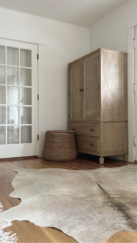 Entryway cowhide hide rug Sausalito cabinet armoire lidded basket rattan 

#LTKhome
