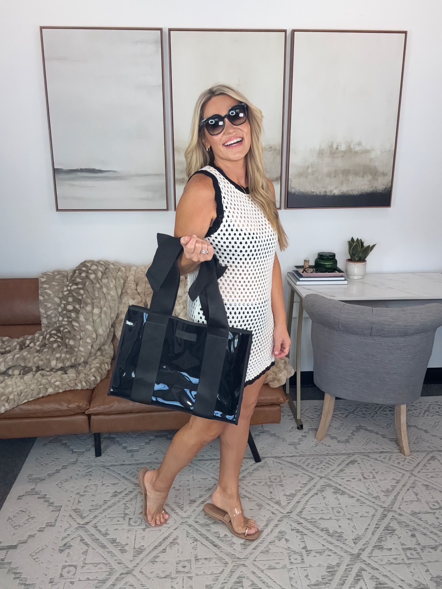 The crochet dress is fun on its own, but the oversized black tote is what makes this feel ready for a full day out. Add sunglasses and simple sandals and you’ve got an easy weekend look with plenty of personality.

crochet mini dress, black and white dress, oversized tote bag, summer weekend outfit, casual dress outfit, black accessories, women’s summer style, vacation outfit, weekend style, crochet dress outfit, AudrieDollins

#LTKSwim #LTKSeasonal #LTKTravel